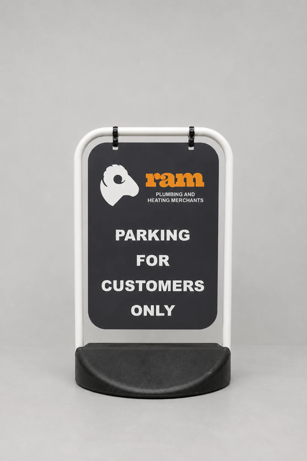 Pavement Sign A with a white metal frame and weighted black base