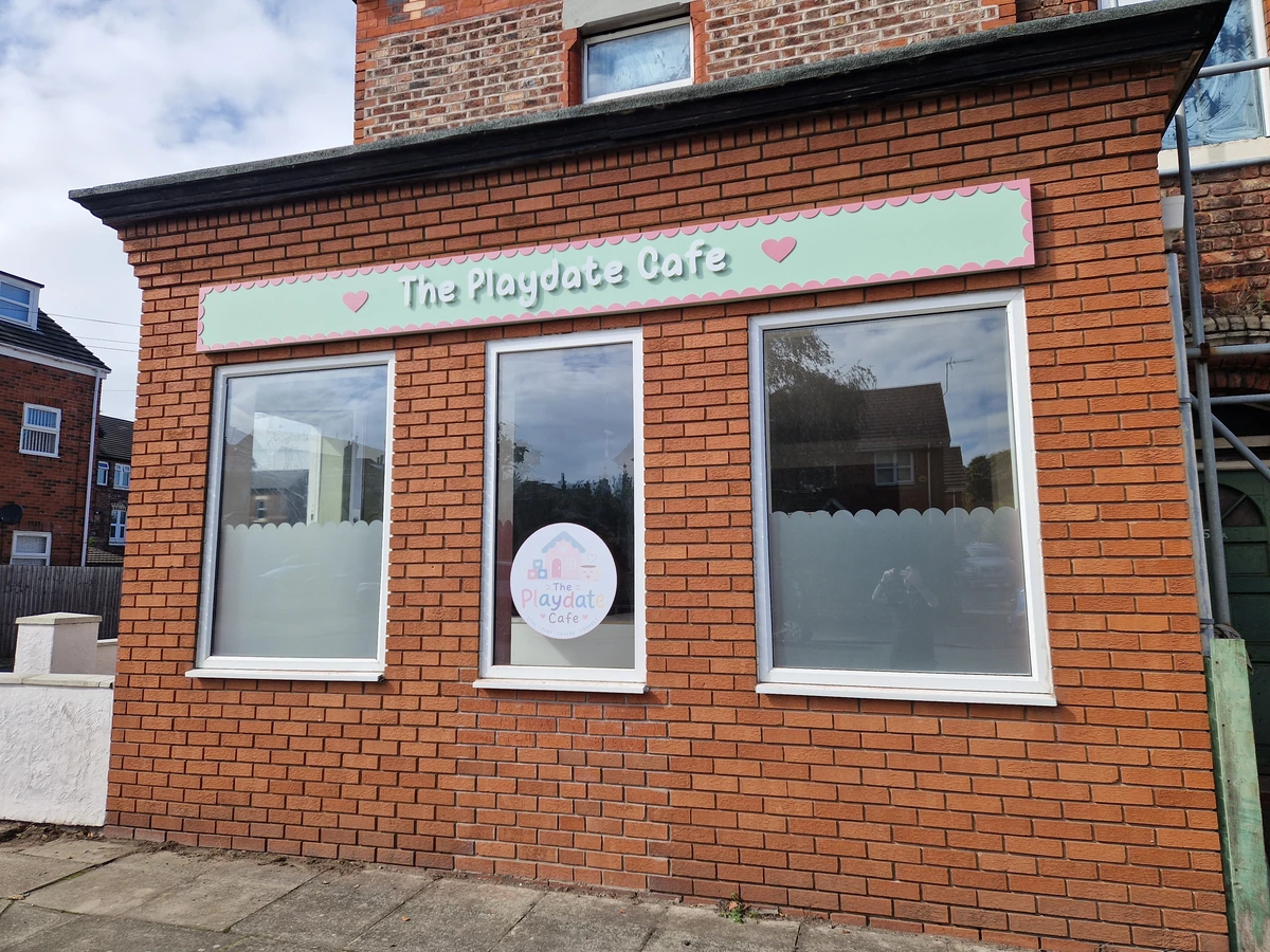 The Playdate Cafe signage and window frosting in New Brighton
