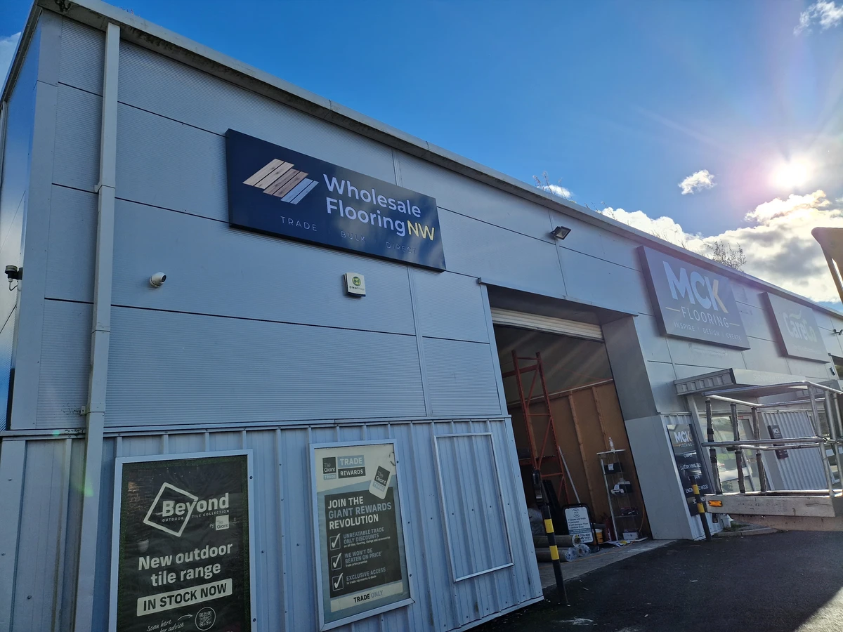 Wholesale Flooring NW fret-cut backlit sign on the Chester premises