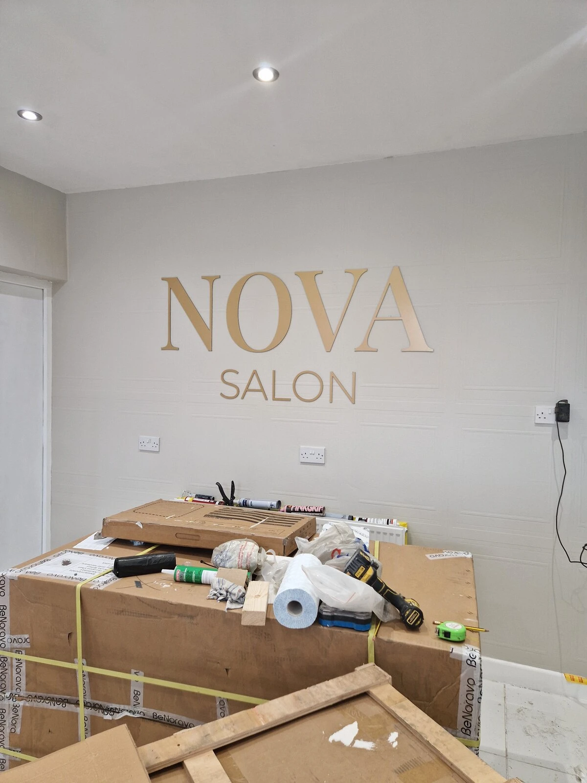 Gold Nova Salon interior wall logo in Burscough