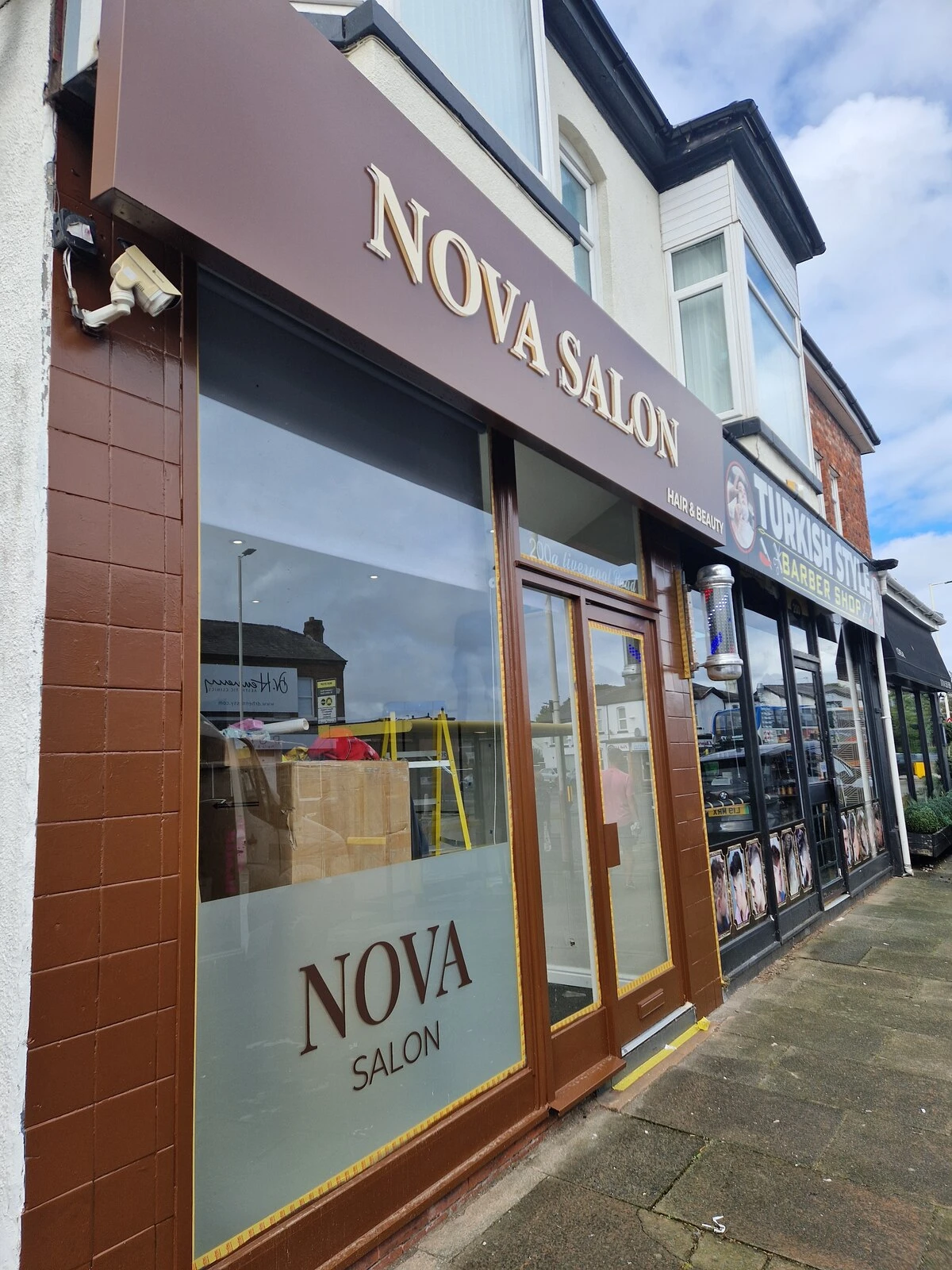 Illuminated Nova Salon shop sign and window frosting in Burscough